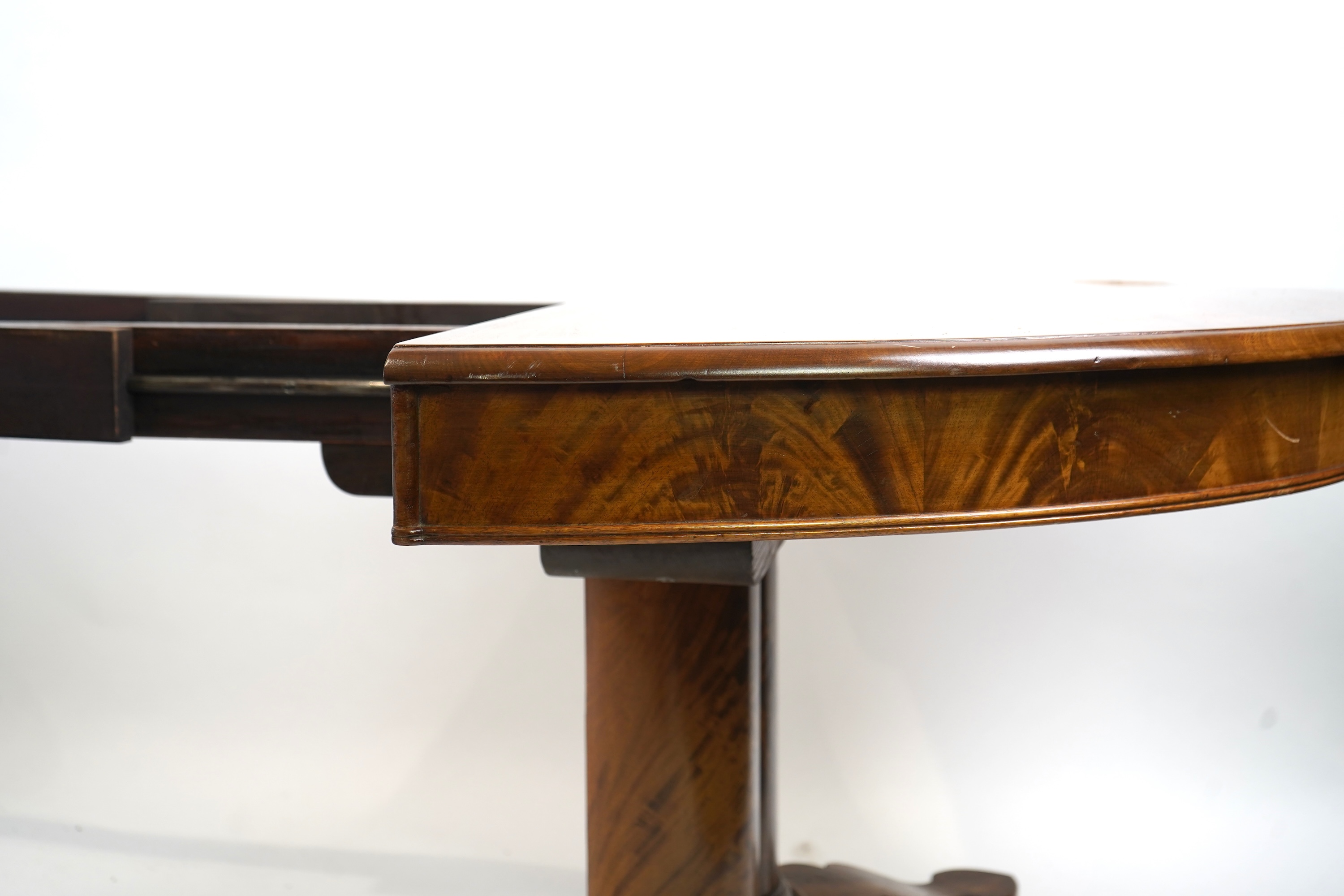 A mid 19th century Continental mahogany extending dining table
